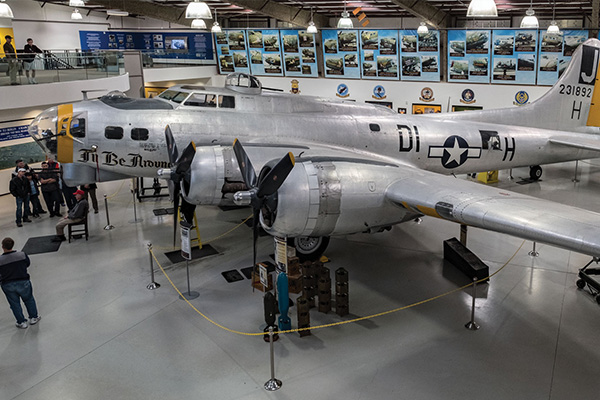 Inside the 390th Memorial Museum hanger with vintage military airplanes