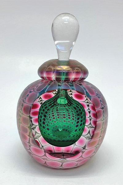 A beautiful blow glass with topper.