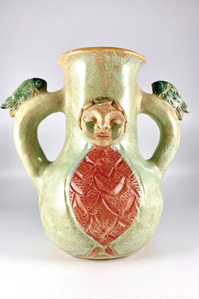 A handcrafted vase with two handles.