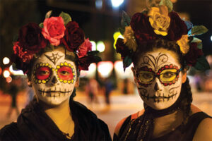 Two woman in full day of the dead makeup